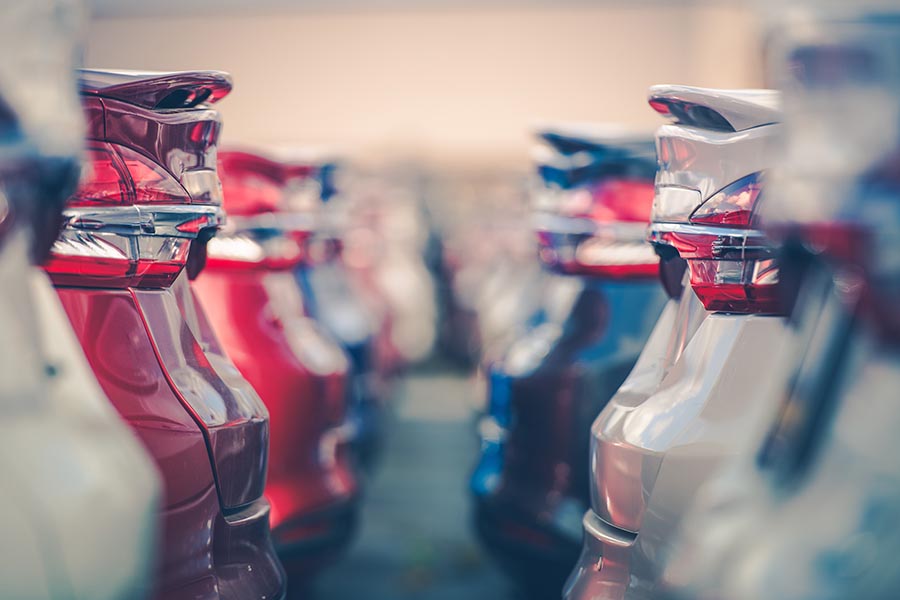 Used Car Dealer and Valet Insurance - Row of Clean Sedan Style Cars Parked Together